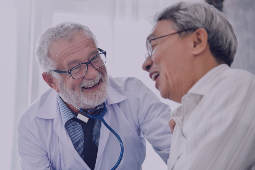 increase patient retention and loyalty; image shows a doctor and patient smiling and laughing